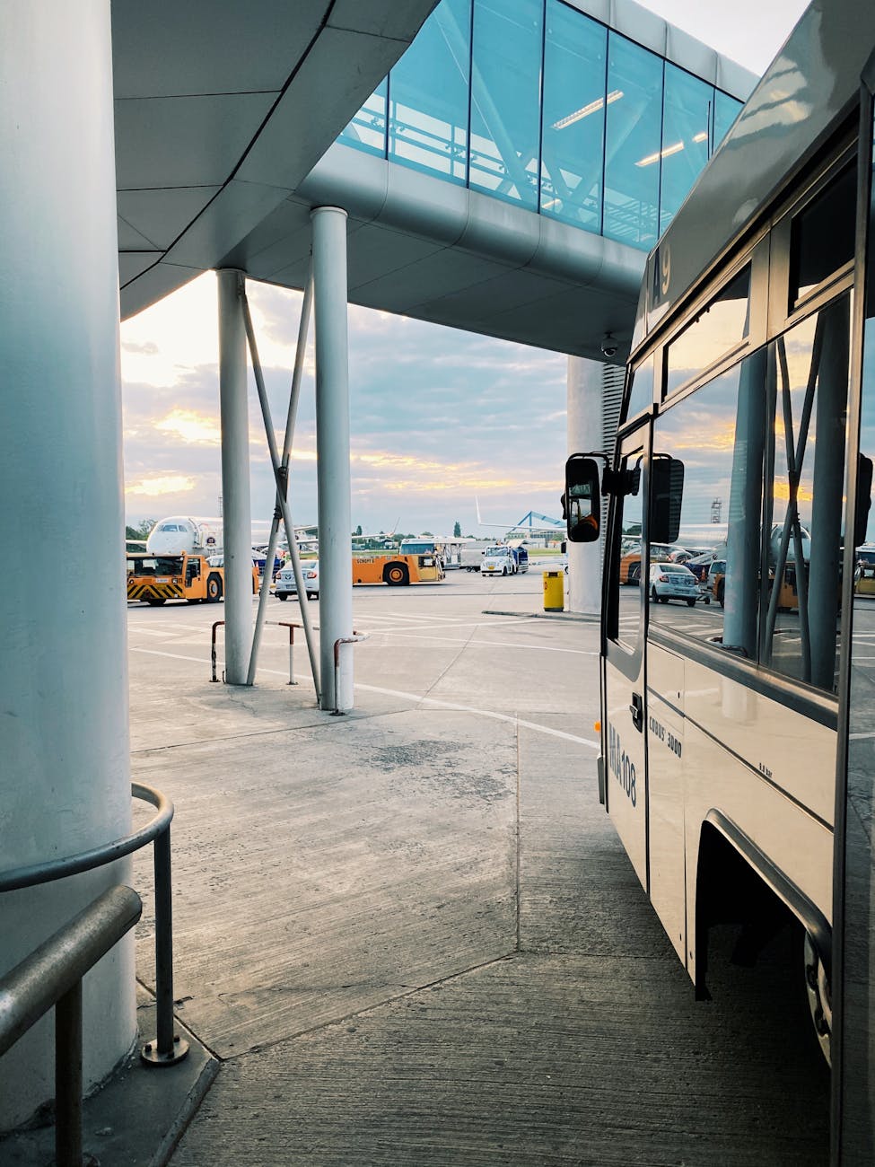 view of a bus and other vehicles at an airport