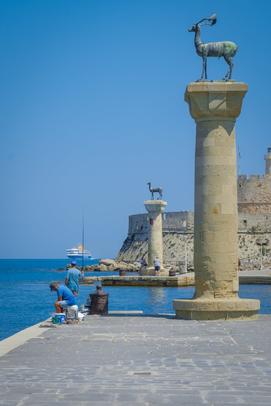 anglers standing on pier of rhodos