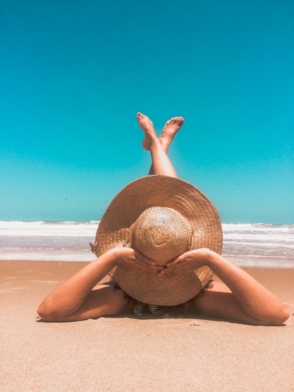 person laying on sand